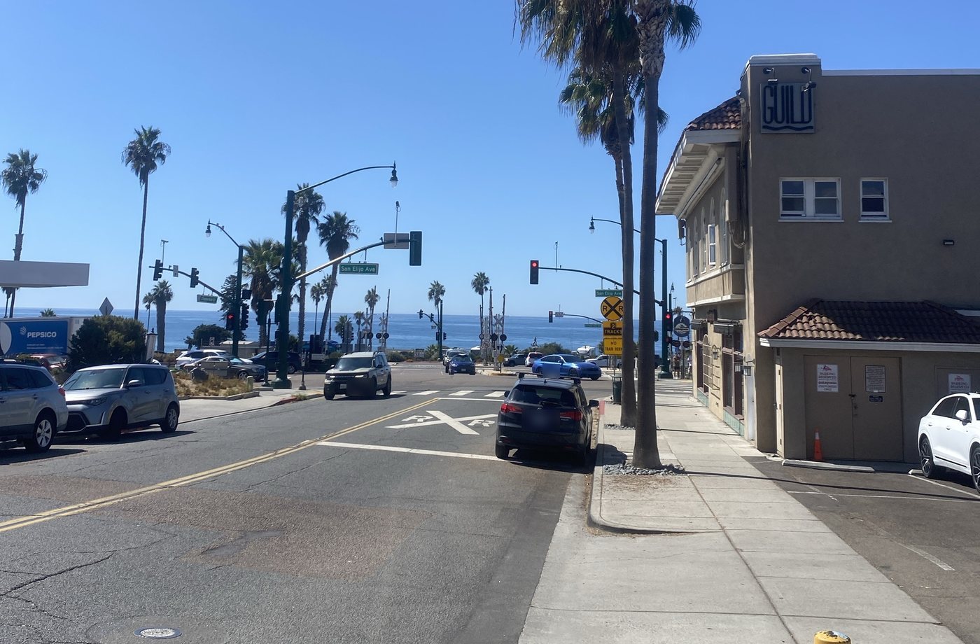 Palms and the ocean at the bottom of the street, at San Elijo Ave in Cardiff