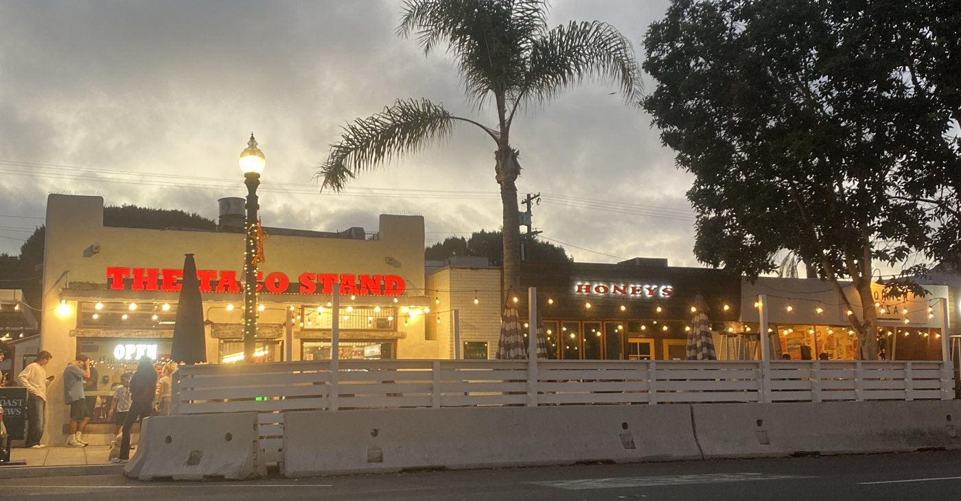 String lights over The Taco Stand and the patios on Highway 101 in Encinitas on a cloudy Friday evening
