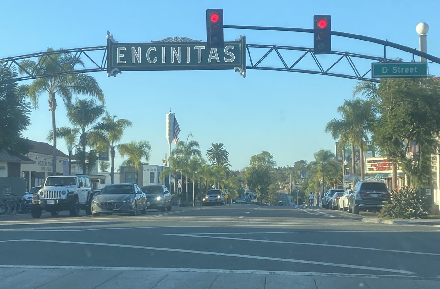 The Encinitas sign over Coast Highway 101 at D Street at golden hour