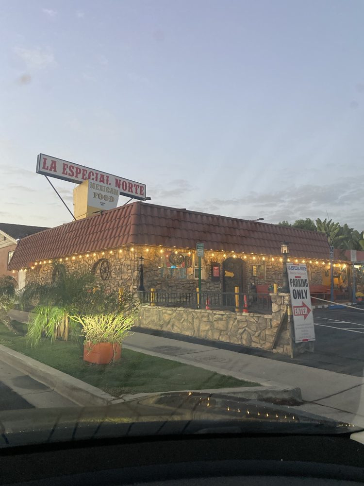 La Especial Norte's stone building with string lights and its 'Mexican Food, Since 1977' rooftop sign