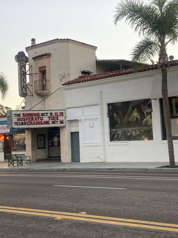La Paloma Theatre's vertical sign and marquee on Coast Highway 101 in Encinitas: 'The Shining Oct 9, 11, 15 / Nosferatu Tues / Texas Chainsaw Oct 16'