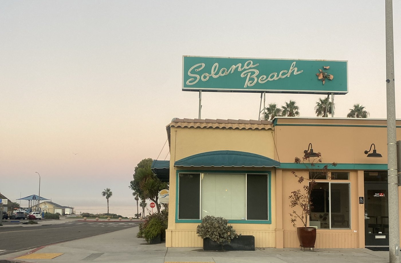 The Solana Beach sign at dawn, Fletcher Cove at the end of the street, photographed by PJ